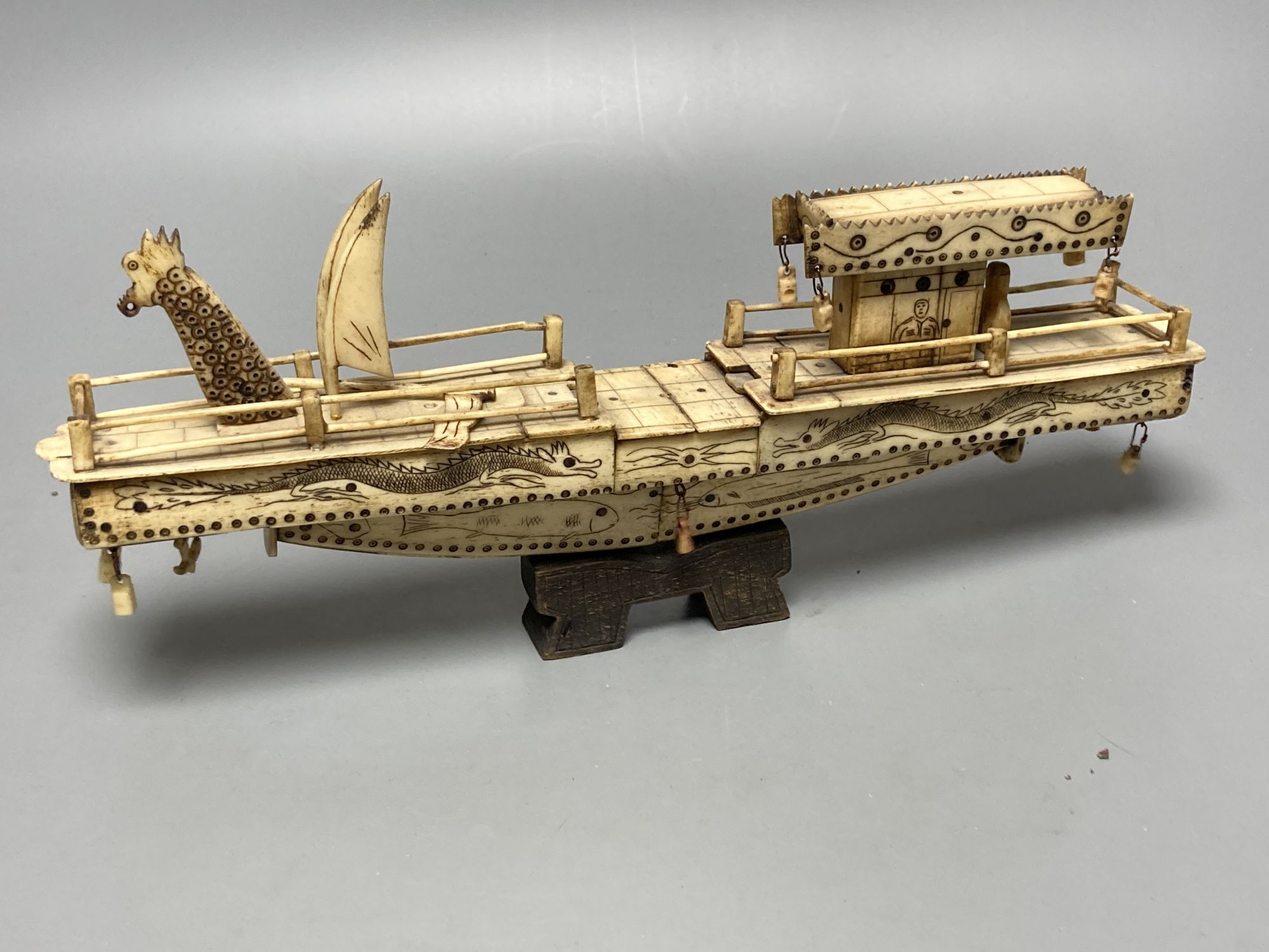 A quantity of bone and ivory carvings including fans and figures